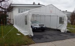 A double car shelter for 2 cars in Quebec